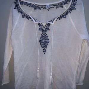 White blouse with pattern around collar